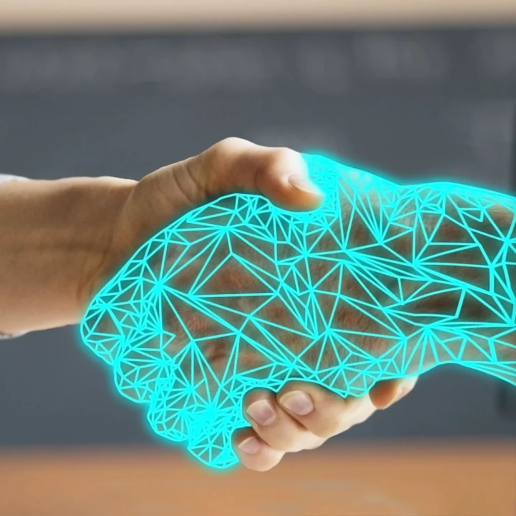 Das Bild zeigt eine linke Hand eines Menschen, der eine digitale Hand festhält.